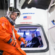 NASA astronaut Randy Bresnik prepares to enter Boeing's CST-100 spacecraft for a fit check evaluation at the company's Houston Product Support Center in this undated image. NASA will partner with Boeing and SpaceX to build commercially owned and operated "space taxis" to fly astronauts to the International Space Station, ending U.S. dependence on Russia for rides, officials said on Tuesday.